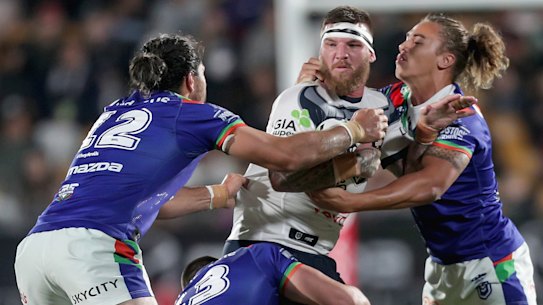 Rounded up: Josh McGuire of the Cowboys is tackled by Tohu Harris, Lachlan Burr and Chanel Harris-Tavita at Mt Smart Stadium.