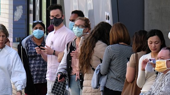 People wait outside a coronavirus screening clinic this week.