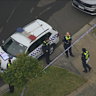 Police investigate the deaths of two people at Dandenong North on Friday.