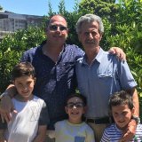 Bill Stingas with his father Leon and three children, back in 2019.