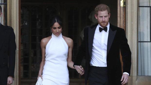 The newly married Duke and Duchess of Sussex, Meghan Markle and Prince Harry, leave Windsor Castle after their wedding.