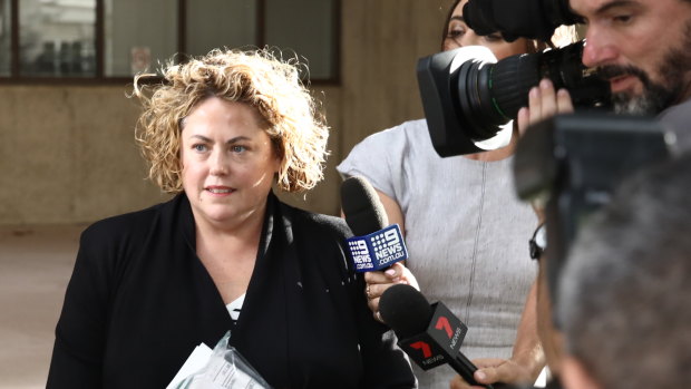 Rosemary Rogers leaving Surry Hills police station on bail.