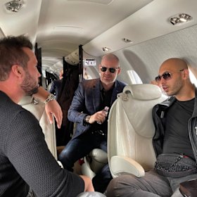 Joule Sullivan (centre) with the Tates on a private jet in Ukraine in 2022.