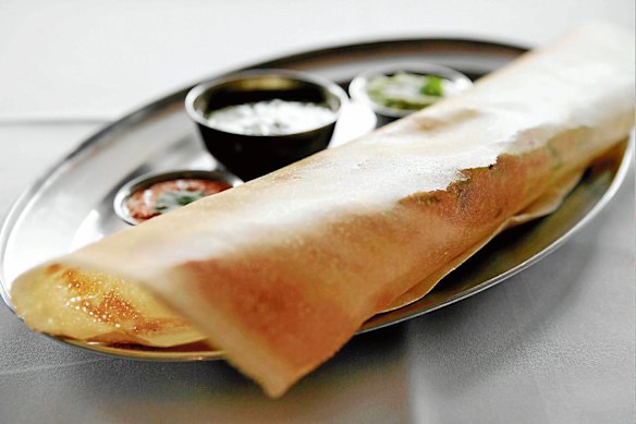 Masala dosa, rice-meal crepes stuffed with spiced potatoes.