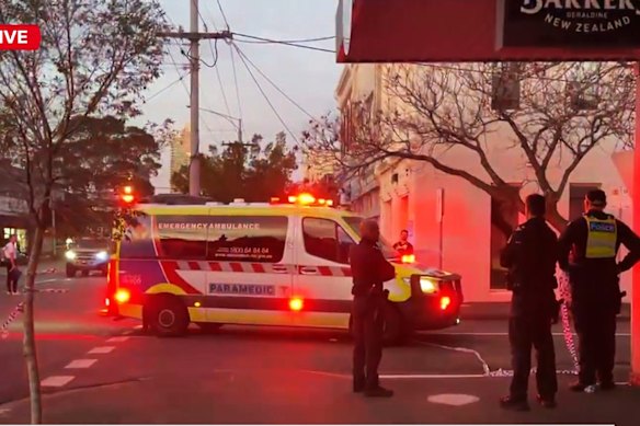 Police and an ambulance at the scene of the shooting in South Melbourne late on Saturday.