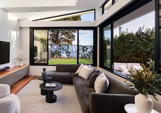 A young family paid $3.5 million for a renovated Federation home in Marrickville with a backyard mural.