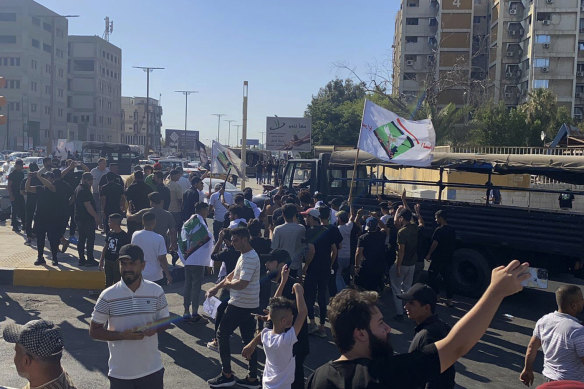 Hundreds of followers of the influential Iraqi Shiite cleric and political leader Muqtada Sadr stand outside the Swedish embassy in Baghdad, Iraq.