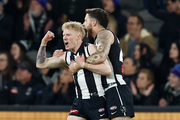 The Pies’ John Noble celebrates earlier.