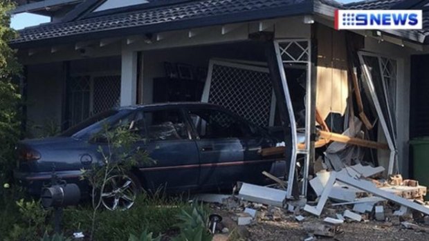 The car crashed into the front room of the unoccupied Loganlea home.