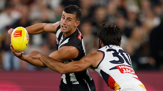 Wayne Milera pays close attention to Nick Daicos.