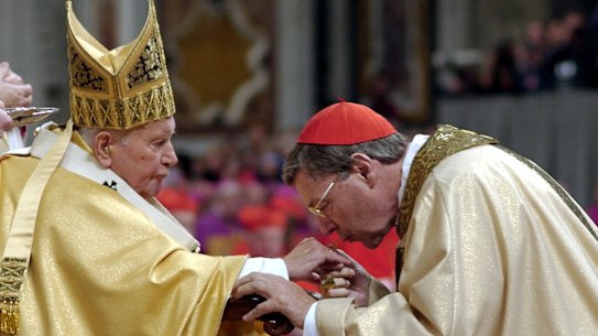 Cardinal George Pell of Australia, Archbishop of Sydney kisses Pope John Paul II’s hand after receiving his ring during a Mass with the newly elevated Cardinals in St. Peter’s Basilica, at the Vatican in 2003.