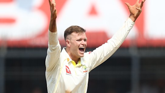Matt Kuhnemann bowls for Australia in India in 2023.