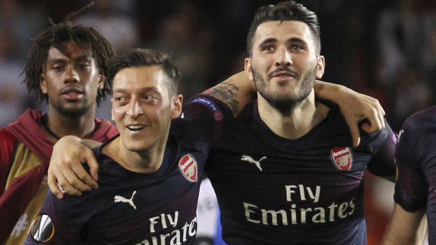 Alarming development: Arsenal midfielder Mesut Ozil and defender Sead Kolasinac have both been withdrawn from the squad due to security concerns.