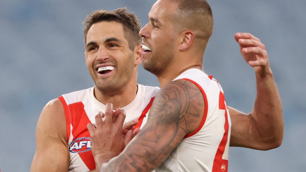 Josh Kennedy celebrates a Swans goal with Lance Franklin.