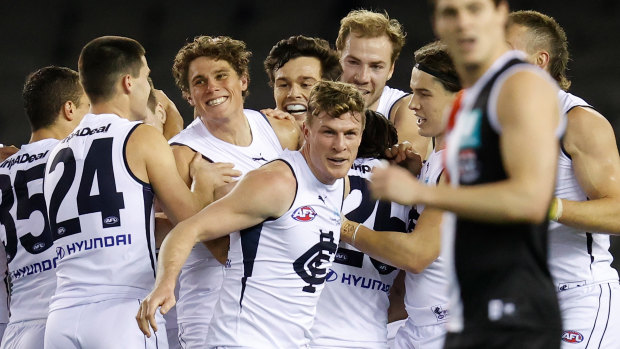 Charlie Curnow (centre) was all smiles in his return to action with the Blues.