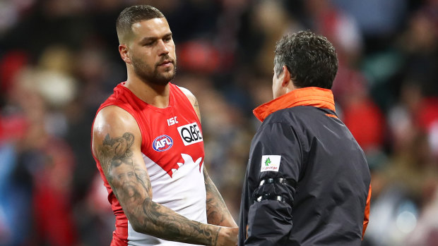 Lance Franklin shakes hands with Giants coach Leon Cameron after the Swans' defeat.