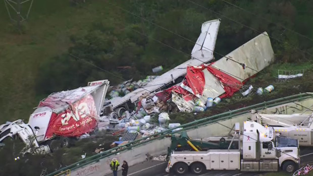 The truck driver has been rescued and emergency services are cleaning up a chemical spill.