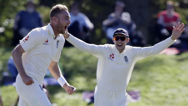 Double down: Stuart Broad celebrates taking his second wicket in as many balls on day five.