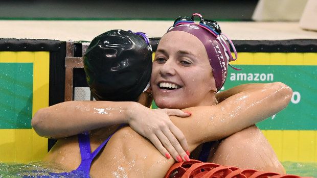 Ariarne Titmus hugs Emma McKeon after the 200m freestyle.