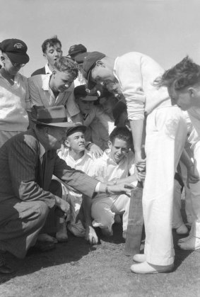 Former Australian cricketer Bill O'Reilly talks with young country cricketers at the Sydney Cricket Ground. January 12, 1954.