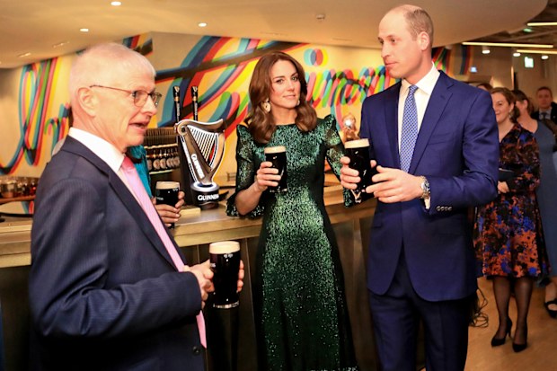 Prince William, Duke of Cambridge and Catherine, Duchess of Cambridge hold a pint of Guinness as they visit the Guinness Storehouses Gravity Bar