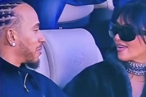 Lewis Hamilton and Kim Kardashian sitting together at Super Bowl LX, February 2026