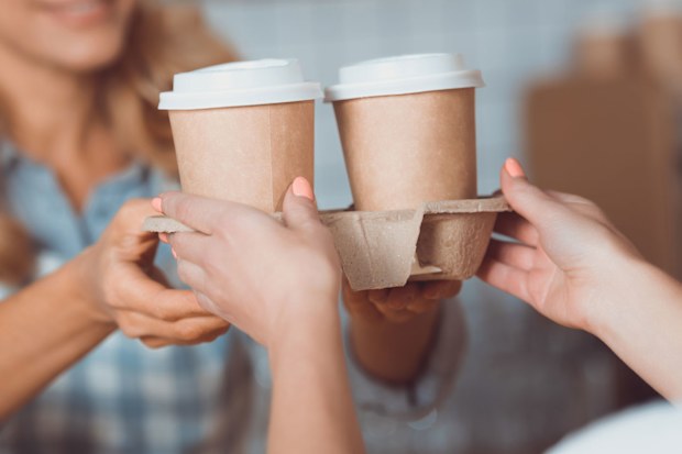 Woman buying takeaway coffee