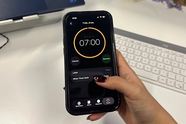 An iPhone with a seven-minute timer running.
