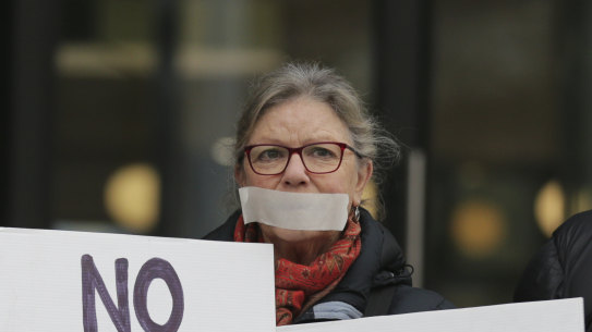 Protesters supporting Witness K’s former lawyer Bernard Collaery in front of the Law Courts in 2019.