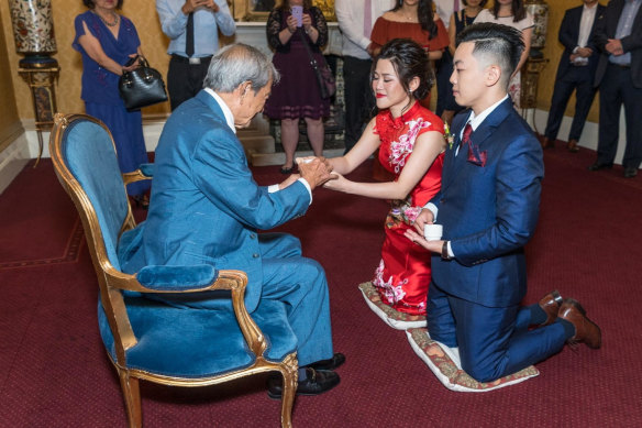 Lee and Lies during a traditional tea ceremony at their wedding reception, with Lee’s maternal grandfather, who has always been a great ally.