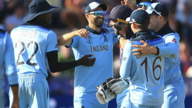 England celebrates after winning the Cricket World Cup match.