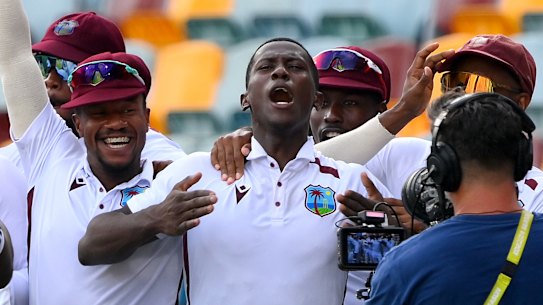 Shamar Joseph celebrates with teammates at the Gabba.