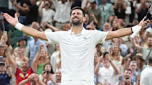 Novak Djokovic won a five-hour-plus classic to make an eighth consecutive Wimbledon semi-final.