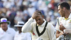Usman Khawaja, left, and Scott Boland leave the pitch at the end of play during day four of the first Ashes Test.