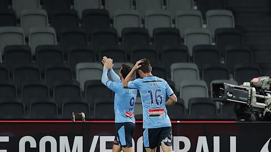 Sydney goalscorer Adam Le Fondre applauds to the empty stand at Bankwest Stadium.