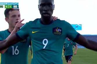 Alou Kuol celebrates his scorpion kick goal for the Olyroos in the Asian Cup.