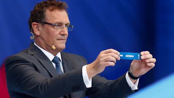 Former FIFA secretary general Jerome Valcke holds the ticket of Australia during the 2014 World Cup draw.