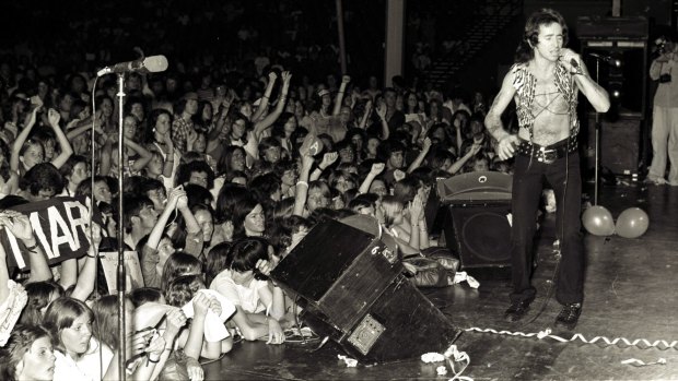 Bon Scott on stage with the band at the Hordern Pavilion in Sydney on December 12, 1976.