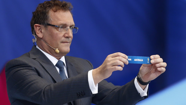 Former FIFA secretary general Jerome Valcke holds the ticket of Australia during the 2014 World Cup draw.
