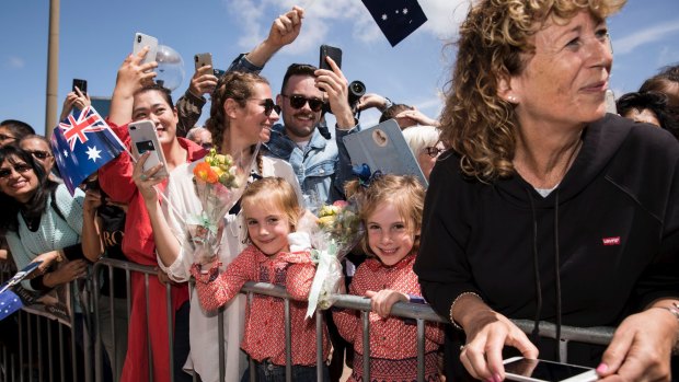 The Duke and Duchess Harry and Meghan meet the crowd outside the Opera House.