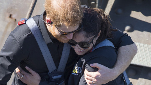 Prince Harry with fellow Harbour Bridge climber Gwen Cherne, the widow of a military veteran who took his own life.