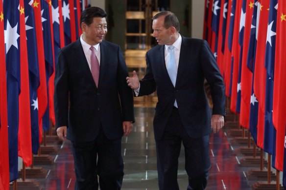 Chinese President Xi Jinping, left, and then prime minister Tony Abbott at Parliament House in Canberra in 2014. 