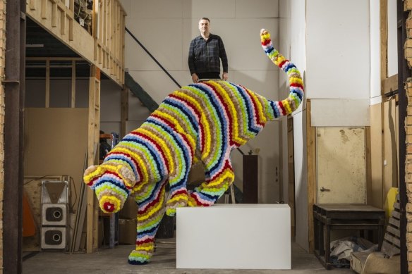 Artist Troy Emery with his work 'Mountain Climber' which will be part of Melbourne Now at NGV. 