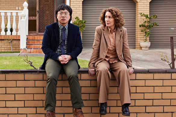 Grumpy lawyer Helen Tudor-Fisk (Kitty Flanagan, pictured with Aaron Chen) finds her tribe in the narrative comedy Fisk.