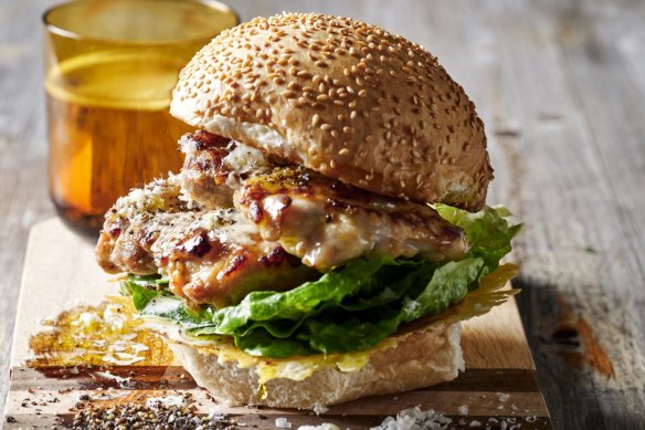 Chicken caesar burger sandwiched by a crispy, lacy, cheesy lid.