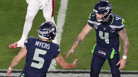 Michael Dickson celebrates with Seattle teammate Jason Myers.