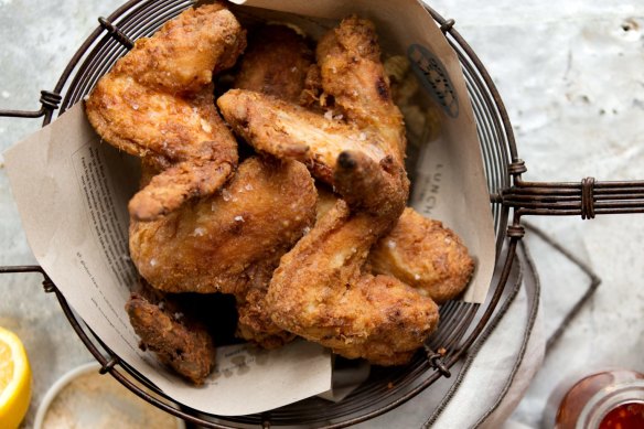 Buttermilk fried chicken with hot sauce.