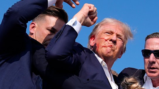 Republican presidential candidate former President Donald Trump is surround by U.S. Secret Service agents at a campaign rally, Saturday, July 13, 2024, in Butler, Pa. (AP Photo/Evan Vucci)