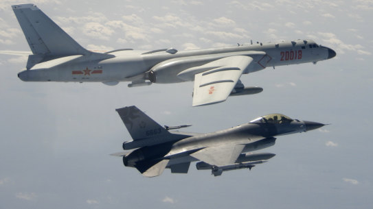 A Taiwanese Air Force F-16 in foreground flies on the flank of a Chinese People’s Liberation Army Air Force H-6 bomber in 2020. 