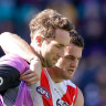 Tom Papley is helped from the Gabba after suffering an ankle injury last Sunday.